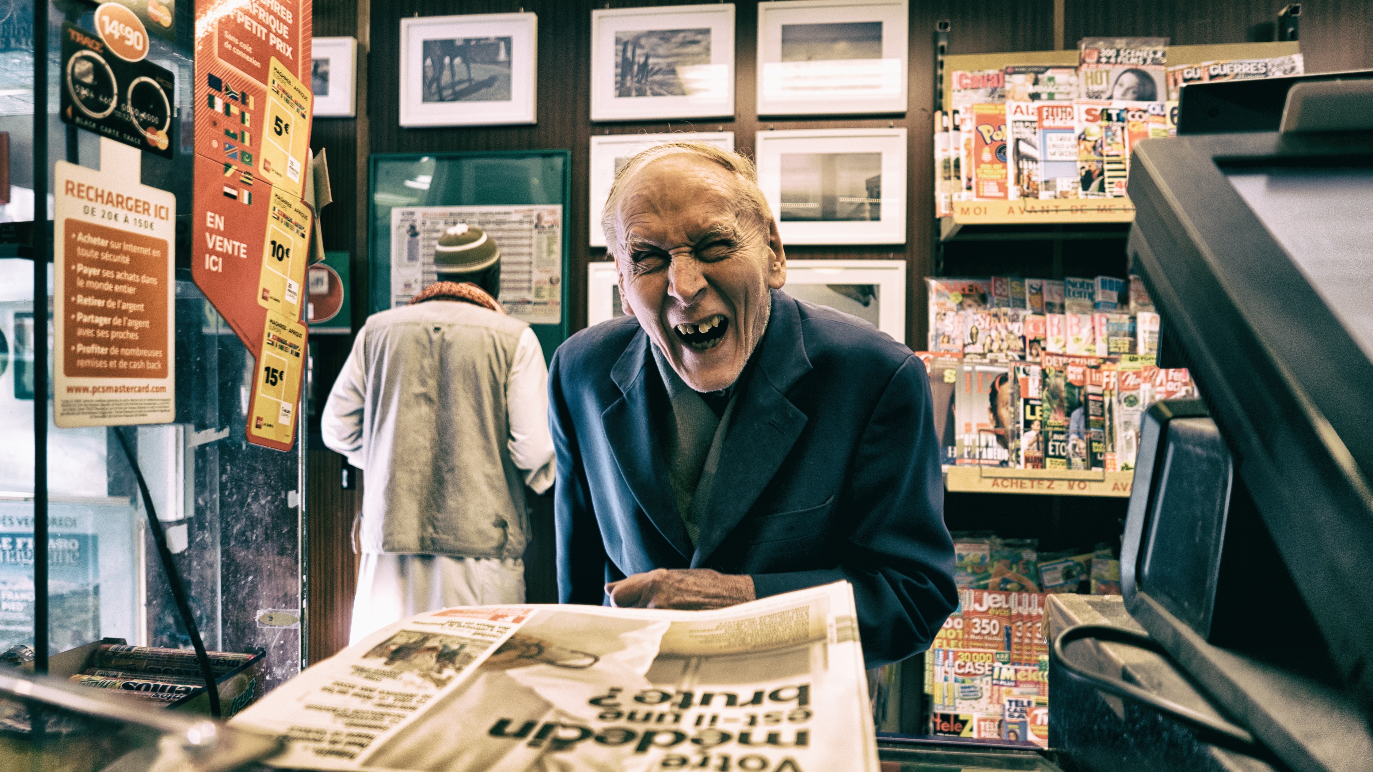 Old Men in Newspaper Shop - Unsplash